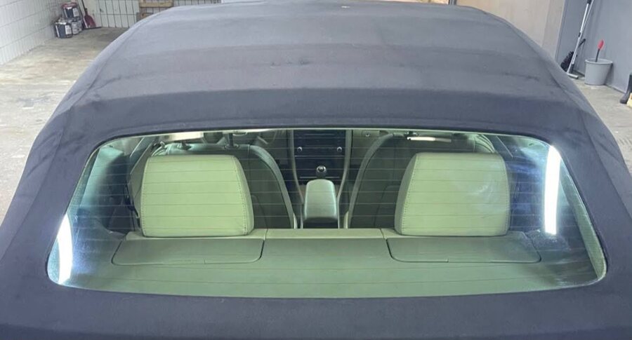 Clear rear window and clean convertible top after car detailing